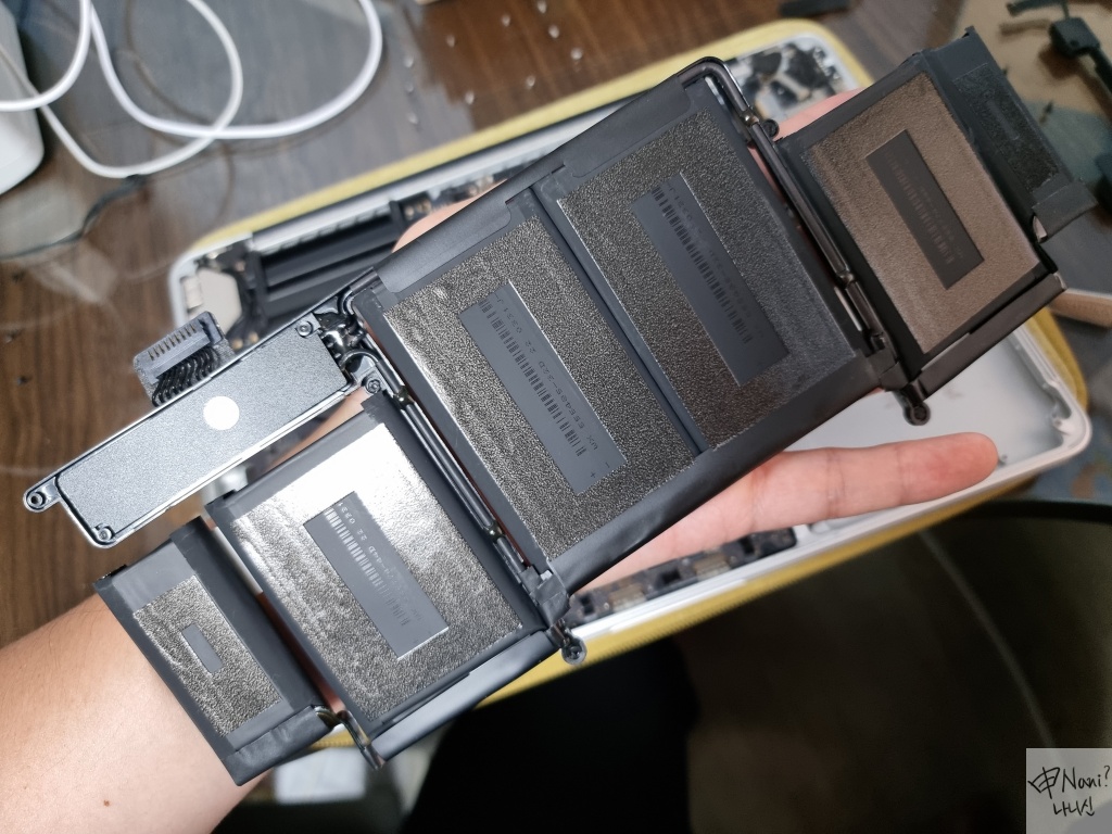 remove bottom plastic cover to use glue of new battery pouch